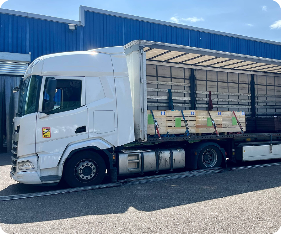 stock-photo-cargo-transportation-of-screws-in-wooden-and-metal-boxes-in-a-semi-trailer-truck-side-loading-of-2333293141 (1) 1